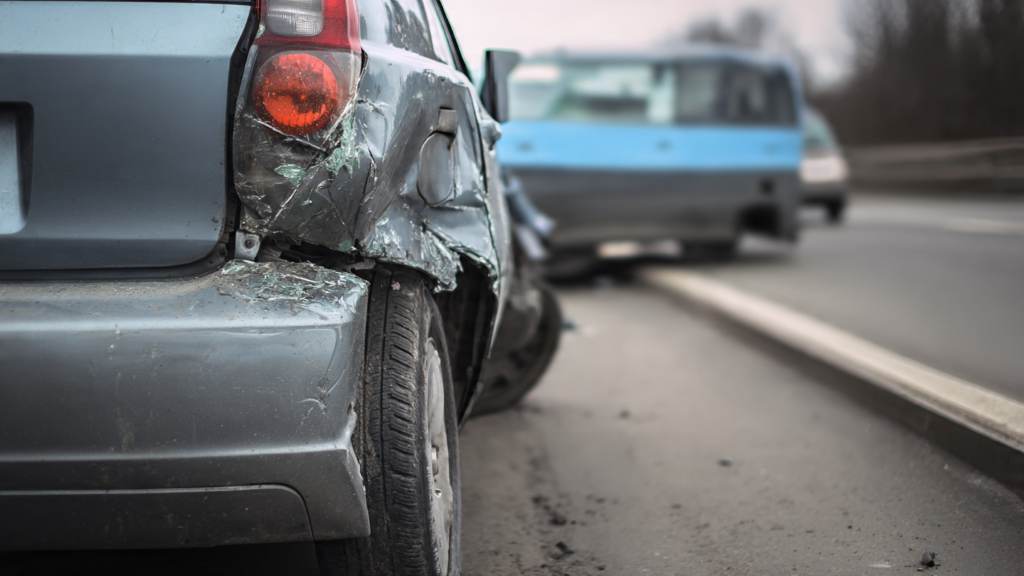 Person exchanging insurance information after accident scene